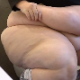 A morbidly obese woman sits down on a toilet and takes a shit and a piss. Grunting and several plops are heard. There is a video flaw at 3:30 minutes into the clip, but does not take away from the actual poop and pee action. 720P HD. About 5.5 minutes.